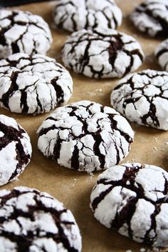 chocolate crinkle cookies with white powdered sugar on wooden board, ready to be eaten