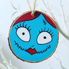 a wooden ornament with an evil face painted on it's face and eyes