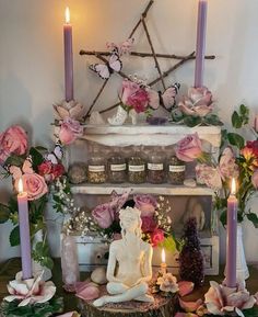 a table with candles and flowers on it