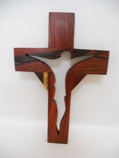 a wooden cross hanging on the wall