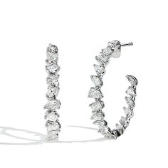 Gorgeous pair of mixed fancy shape diamond inside out hoop earrings featuring emerald cut diamonds, pear shapes, and marquise diamonds in 18k white gold. Pair it with our other Private Label pieces from our Fancy Shape Diamond collection for the perfect look. Fancy Shape Diamond Earrings, Marquise Baguette Diamond Jewelry In White Gold, Silver Marquise Jewelry With Baguette Diamonds, Platinum Jewelry With Baguette Diamonds In Marquise Cut, Platinum Jewelry With Baguette Diamonds And Marquise Cut, Platinum Jewelry With Marquise Cut Baguette Diamonds, Diamond Hoops Earrings, Pear Shapes, Diamond Earrings Design