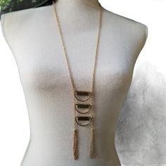 Shop marijos's closet or find the perfect look from millions of stylists. Fast shipping and buyer protection. Beautiful 36" gold tone sweater neckkace. It had 3 dangling grayish tone( could look lighter or darker with the light ) bars that end in 2 chain tassels. New with tag Item# RR- 6564-2. FMP Sweater Necklace, Light Bars, Gold Sweater, S Jewelry, Long Necklaces, Jewelry Studio, Gift Jewelry, Studio S, Bar Lighting