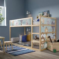 a child's bedroom with bunk beds and toys on the floor in front of it