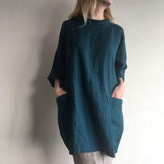 "Loose linen tunic with pockets. Great choice when you need comfortable and stylish outfit combination. You can wear it with trousers, leggings, shorts, skirts. The good thing about tunics is that you can wear them also by themselves with nothing or for example as beach cover ups. Linen tunic dress is perfect for warm days and vacation. As linen regulates body temperature, is lightweight and really absorbent, which makes it the perfect fabric for summer. ABOUT Length of this linen tunic is ± 88 Cotton Tunic With Pockets And Relaxed Fit, Relaxed Fit Cotton Tunic With Pockets, Green Relaxed Fit Linen Dress With Pockets, Lagenlook Long Sleeve Linen Tunic, Relaxed Fit Flax Linen Dress With Pockets, Oversized Linen Beach Dress With Pockets, Relaxed Fit Tunic With Pockets For Daywear, Linen Tunic Dress With Pockets, Spring Tunic With Pockets And Relaxed Fit