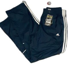 Sporty Blue Joggers With Three Stripes Branding, Sporty Blue Sweatpants With Three Stripes Branding, Blue Sweatpants With Three Stripes For Streetwear, Blue Sporty Sweatpants With Three Stripes Branding, White Adidas Jogging Pants, Blue Sporty Joggers With Three Stripes, Blue Adidas Activewear For Jogging, Blue Sportswear Joggers With Three Stripes, Blue Sports Joggers With Three Stripes