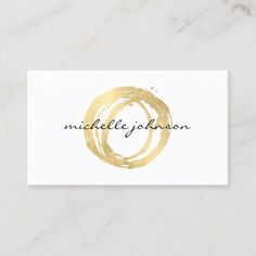 a white business card with gold foil on it that says, middlelife jackson in the center