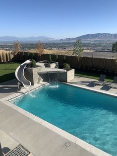 a swimming pool with a slide in the middle