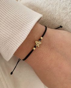 This a dainty and minimal letter bracelet. D E T A I L S Tiny 18k gold plated Initial Charm ~ 7mm ~ with clear cubic zirconia. Adjustable cotton cord with macrame closing . Available colours: Black, Dark red, Mocca , Dark Blue, White Dainty Gold Bracelet With Sliding Knot, Elegant Personalized Gold Friendship Bracelets, Elegant Yellow Gold Friendship Bracelets As Gift, Adjustable Gold Name Bracelet As Gift For Her, Initial Bracelet Couples, Bracelets With Initials, Bracelets For Bridesmaids, Bracelet With Initials, Letters Bracelet