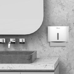 a bathroom with a sink, mirror and soap dispenser