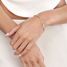 Let your style speak volumes with the subtle elegance of our Polished Hinged Bangle from Olas d'Oro. This exquisite 14K yellow gold bangle is more than just jewelry; it's a statement of your unique style.Crafted to perfection, this 3mm x 1.5mm bangle boasts a polished finish that catches the light with every movement, adding a touch of brilliance to your ensemble. Its hinged design ensures ease of wear, and the secure snap-lock clasp guarantees it stays comfortably in place.The beauty of this ba Yellow Gold Bangle, Snap Lock, Subtle Elegance, Tennis Necklace, Gold Bangle, Outfit Making, Timeless Accessories, Gold Polish, Hinged Bangle