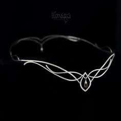 a white wire headband on a black background