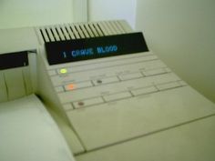 a close up of an electronic device with the word i choose blood written on it