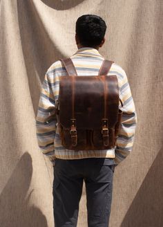 Leather Utility Backpack, Handmade Leather Rucksack, Personalised Leather Laptop Backpack, Leather Trekking Backpack, Leather Hiking Bag Men Women Dimensions: 12 X 16 X 5 Inches The Leather Backpack is beautifully crafted while ensuring the durability and utility respective to all kinds of outdoor activities. The product is made by using 100 % Buffalo Full Grain leather with Polyester lining. We have used premium quality Waxed Buffalo leather. The Leather Backpack has four spacious pockets on th Leather Backed Backpack For Everyday Use, Vintage Leather School Backpack, Rugged Backpack For Everyday Use, Rugged Backpack With Leather Lining, Classic Leather Backpack With Leather Backing For Outdoor, Rugged Leather Rectangular Backpack, Rugged Leather-lined Backpack, Rugged Leather Standard Backpack, Rugged Rectangular Backpack For Daily Use