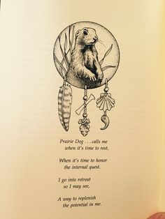 an open book with a drawing of a groundhog holding a dream catcher in it's hand