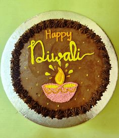 a chocolate cake with the words happy diwali written on it