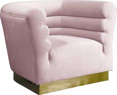 a pink chair with gold trim around the legs