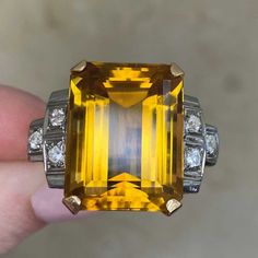 Franconia Ring. Circa 1940 (Antique, Retro Era) - EDJ Luxury Citrine Topaz Ring With Emerald Cut, Yellow Emerald-cut Topaz Ring, Art Deco Diamond Topaz Ring, Formal Art Deco Topaz Ring With Center Stone, Yellow Topaz Emerald-cut Ring In Fine Jewelry, Yellow Emerald-cut Topaz Ring Fine Jewelry, Yellow Emerald Cut Topaz Ring In Fine Jewelry Style, Classic Octagon Topaz Center Stone Ring, Classic Octagon Topaz Ring With Prong Setting