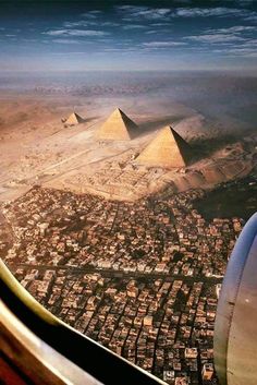 an airplane flying over the pyramids of giza in egypt, taken from above