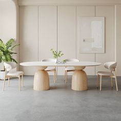 a white table with four chairs and a potted plant in the corner next to it