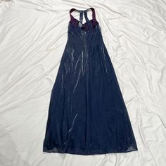 Vintage 1990s blue maxi dress. Lined. In good vintage condition. Note: I try to match colors as much as possible to pictures but there is a possibility it won't be an exact match. Unless the color is completely incorrect I am unable to offer refunds for this reason. Size: 11-12, fits like a medium Brand is Blondie and Me Evening by Linda Bernell Measurements (taken on garment laid flat): Armpit to armpit: 15.5" Waist: 30" Armpit to hem: 47.5" Hips: 47" Fabric: 70% acetate, 30% mylar, lining - 100% polyester Blue 90s Prom Dress, Blue Sleeveless Vintage Maxi Dress, Blue Y2k Sleeveless Dress, Blue Sleeveless Sleep Camisole, Vintage Blue Sheer Sleepwear, Gown Vintage, Blue Maxi Dress, Match Colors, Womens Vintage Dresses