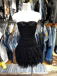 ♥ D E S C R I P T I O N ♥ Adorable vintage 1980's black ruffle dotted tulle mini dress. Features a bow trimmed sweetheart neckline, with ruching along the bust and low waist, and a tiered ruffle skirt.  ♥ S I Z E & M E A S U R E M E N T S ♥ Length: 27.5 in Bust: 15 in Waist: 13 in Hips: 19 in Labeled size 8 Fits size small ♥ Authenticity Guarantee ♥ All items sold in our shop are 100% guaranteed authentic or your money back. Homecoming Dress 2000s, Vintage Ruffled Mini Dress For Party, Vintage Mini Dress With Ruffles For Party, Vintage Ruffle Mini Dress For Party, Coquette Mini Dress With Ruffles For Evening, Low Waist Dress, Dress Up Wardrobe, Goth Fits, Applique Jacket