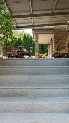 the stairs lead up to an outdoor patio area