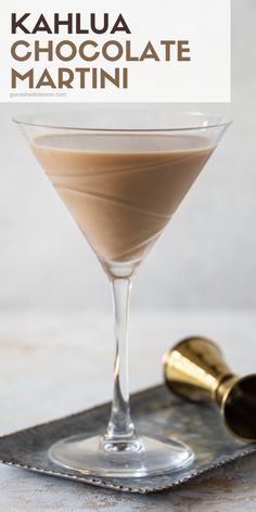 a chocolate martini in a glass on a tray