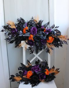 a white chair with purple and orange flowers on it