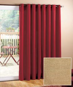 red curtains are hanging in front of a sliding glass door