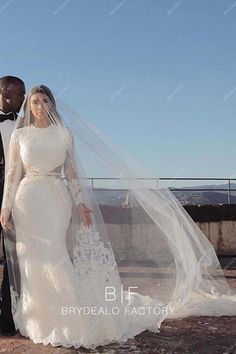 a bride and groom posing for a photo