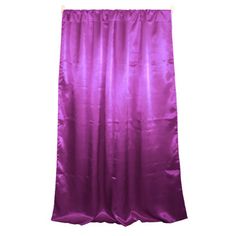 a purple shower curtain hanging on a white wall with clippings to the side