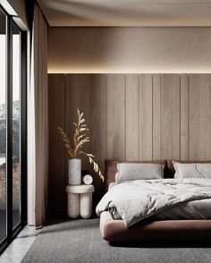 a large bed sitting in the middle of a bedroom next to a tall wooden wall