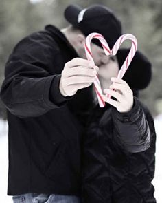 a man holding a candy cane in front of his face with the caption christmas, your way net images may be subject to copyright - send