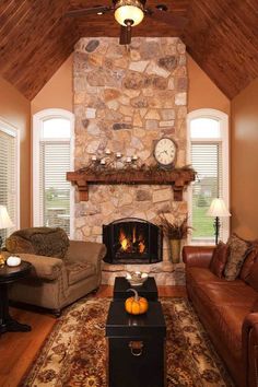 a living room filled with furniture and a fire place