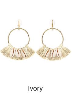 a pair of earrings with tassels hanging from the front and back of it