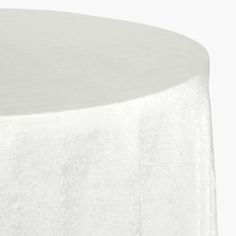 a white table cloth on top of a round table