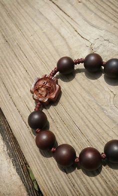 +. This is a Wooden Rosary Bracelet. +.It is knotted bracelet and it is adjustable . It can fit most wrist. +.The crufix is carved in elevorate and three dementional shape. +.+.+.+.+. Materials +.+.+.+.+.+. Cross: impregnation Maple(brown) Beads : Jujube Tree +.+.+.+.+. Size +.+.+.+.+. Cross : 19.9mm(Width) *19.9mm(Height) Beads: 13mm +.The tree that made the cross is spallted Maple. On the back of the cross What looks like a pattern is a' spalting'. 'Spalling' is invaded by mycelium trying to b Spiritual Rosary Bracelet With Wooden Beads, Brown Rosary Bracelet With 8mm Beads For Meditation, Adjustable Wooden Bracelet With 8mm Beads, Adjustable Wooden Beads Rosary Bracelet For Meditation, Adjustable Wood Spiritual Bracelets, Adjustable Wooden Spiritual Bracelets, Spiritual Brown Rosary Bracelet For Meditation, Adjustable Wooden Beads Spiritual Rosary, Spiritual Brown Rosary Bracelet With Wooden Beads