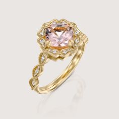 with an antique touch and a royal presence this ring is for a real princess. The center stone is a breathtaking morganite with a pinkish glow to it held by 8 magnificent claws. The stone is surrounded by 12 dazzling white diamonds set exquisitely in paisley like gold shapes. The band is waivy gold, dotted and encrusted with diamonds as well. This ring is just heart stopping from every angle. All features can be customized! please contact us if you wish to make changes, we love making custom designs. All of our jewelry is carefully handmade in our atelier *HC diamond are all conflict free diamonds To order by phone click here>> +972(0)722991000 Classic Pink Diamond Cluster Ring, Luxury Morganite Diamond Ring With Prong Setting, Classic Pink Cluster Ring For Formal Occasions, Luxury Morganite Ring With Accent Stones, Luxury Morganite Ring With Prong Setting, Elegant Morganite Diamond Ring With Gemstone, Elegant Morganite Ring With Center Stone, Elegant Morganite Diamond Ring With Prong Setting, Luxury Morganite Diamond Ring With Halo Setting