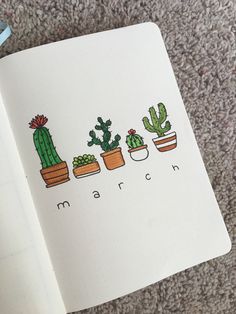 an open notebook with cactus and succulents drawn on the pages in it