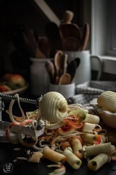 a pile of food sitting on top of a table next to a pair of scissors