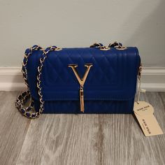 Magic Bag New With Tags Blue V Purse Gold Accents Chain Strap Royal Blue Clutch Purse, Chic Blue Bag With Chain Strap, Blue Evening Shoulder Bag With Chain Strap, Blue Everyday Bag With Chain Strap, Blue Bags With Chain Strap For Everyday, Blue Bag With Chain Strap For Everyday Use, Everyday Blue Bags With Chain Strap, Blue Party Bags With Gold-tone Hardware, Blue Rectangular Bag With Chain Strap