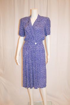 "80s graphic pattern of white on periwinkle blue Maggie London Petites Dress by Jeannene Booher Lovely flattering feminine style with an edgy 80s print Faux wrap style with snap and button closure at waist Small shoulder pads which could be snipped out to remove 100% Rayon Size 8 Measures laying flat: 17\" armpit to armpit, 13.5\" across waist, 17\" shoulder to waist, 26\" from waist to hem Condition: Very Good Vintage Condition" 80s Print, Periwinkle Blue, Petite Dresses, Graphic Patterns, Feminine Style, Wrap Style, Shoulder Pads, Dress Outfits, London