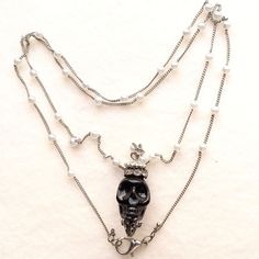 Nwot Skull Carved Resin Bead Chain Is Silver0late With Faux Pearl's Lobster Claw Casp Clear Rhinestone Crown Measurements In Photos Edgy Silver Beaded Jewelry, Punk Skull Necklace With Chain, Gothic Skull Necklace With Chain, Gothic Metal Necklace With Beaded Chain, Gothic Necklaces With Beaded Metal Chain, Silver Beaded Punk Jewelry, Silver Skull Chain Necklace, Silver Skull Shaped Chain Necklace, Edgy Skull Chain Jewelry