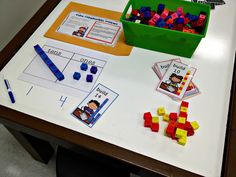 a table topped with lots of different types of legos and building blocks on top of it