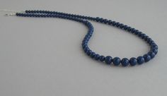 Lapis blue Swarovski pearls necklace is available in 16 inches (40.5cm), 18 inches (45.5cm) and 20 inches (51cm) long and it has an extension 2 inches (5cm) long. Please select the length for necklace. Materials and sizes: The Swarovski pearls are made in Austria. Pearls are 8mm, 6mm and 4mm Color: Lapis blue Sterling silver chain clasp and crimps The necklace will be shipped in a small gift box. If you need more quantity? Contact us. We'd be happy to make custom pieces for you as well! Thank yo Elegant Blue Necklace With 8mm Beads, Elegant Blue Necklaces With 8mm Beads, Classic Blue Pearl Necklace For Gift, Formal Blue Single Strand Beaded Necklace, Blue Single Strand Pearl Necklace Gift, Blue Single Strand Pearl Necklace As Gift, Blue Single Strand Pearl Necklace For Gift, Blue Single Strand Pearl Necklace For Formal Occasions, Formal Blue Single Strand Pearl Necklace