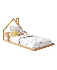 a small bed with a wooden frame and white bedspread on top of it