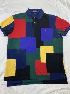 RARE VTG RALPH LAUREN POLO 100% COTTON COLORBLOCK SHORT SLEVE POLO SHIRT PONY LOGO EXCELLENT CONDITION. SOME AREAS OF DISCOLORATION-SEE LAST 3 PICTURES. COLLAR LABEL IS DAMAGED DUE TO DRY CLEANING LABEL BEING PULLED OFF. TAGGED SIZE M MEASUREMENTS LAYING FLAT CHEST- 21 1/2” SHOULDERS-19” LENGTH-28” Multicolor Collared Top With Color Matching, Fitted Color Block Polo Shirt, Casual Collared T-shirt With Patchwork, Casual Collared Patchwork T-shirt, Black Polo Collar Top With Patchwork, Short Sleeve Cotton Polo Shirt With Color Block, Short Sleeve Color Block Cotton Polo Shirt, Color Block Cotton Polo Shirt, Color Block Cotton Short Sleeve Polo Shirt