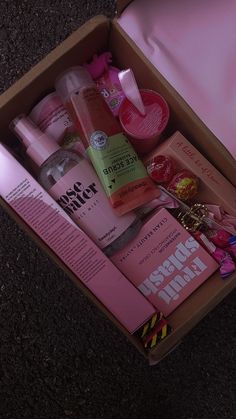 an open pink box filled with personal care items