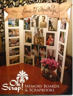 a table with pictures on it and a sign that says memory boards & scrapbooks