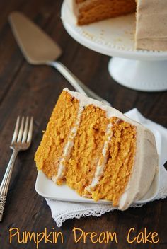 a piece of cake sitting on top of a white plate next to a knife and fork